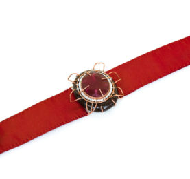 Italian contemporary jewelry: Bracelet Aes, 2017, made of papier-mâché, root ruby, copper, red silk. Handmade baroque jewelry by italian artist Gian Luca Bartellone, Bolzano.