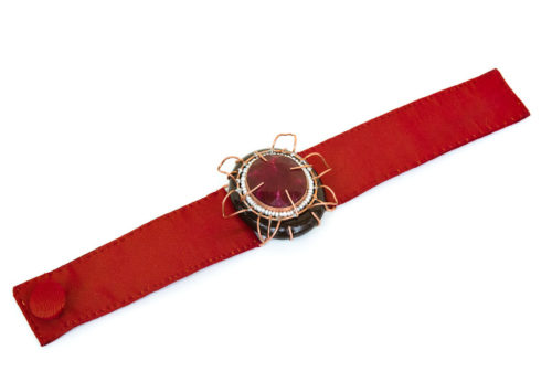 Italian contemporary jewelry: Bracelet Aes, 2017, made of papier-mâché, root ruby, copper, red silk. Handmade baroque jewelry by italian artist Gian Luca Bartellone, Bolzano.