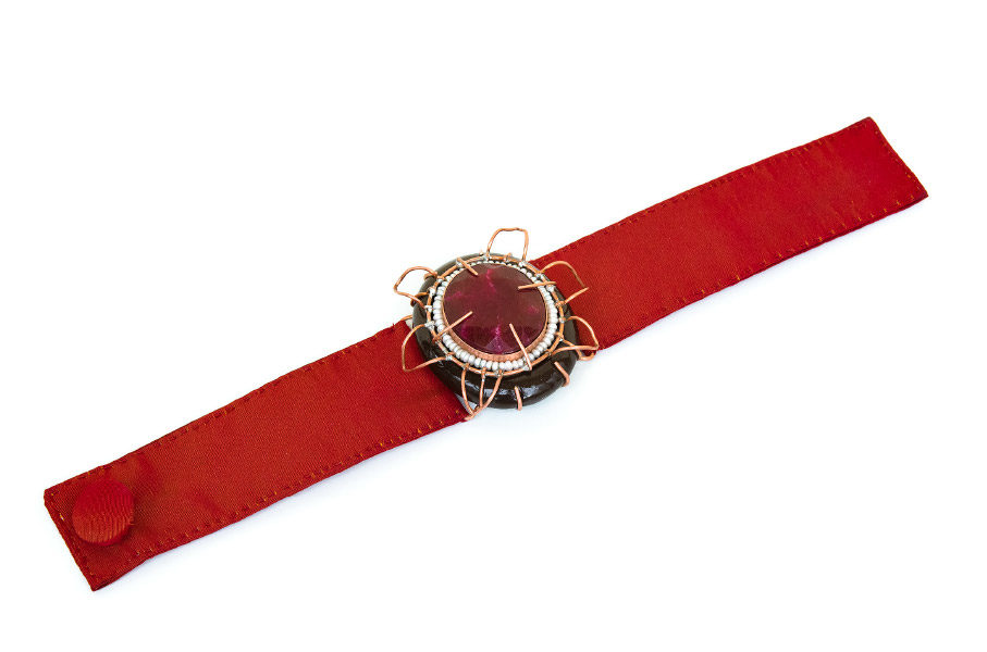 Italian contemporary jewelry: Bracelet Aes, 2017, made of papier-mâché, root ruby, copper, red silk. Handmade baroque jewelry by italian artist Gian Luca Bartellone, Bolzano.