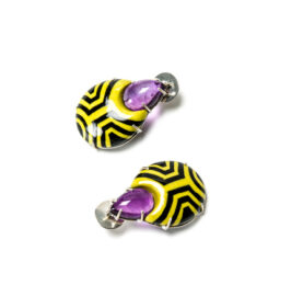 Contemporary jewelry from Italy: Earrings Cavus 2 Limited Edition, yellow and black pattern. Materials: papier-mâché, gold 18kt, silver, amethysts. Gian Luca Bartellone exhibited at Loot, MAD Museum of Art and Design, New York City.